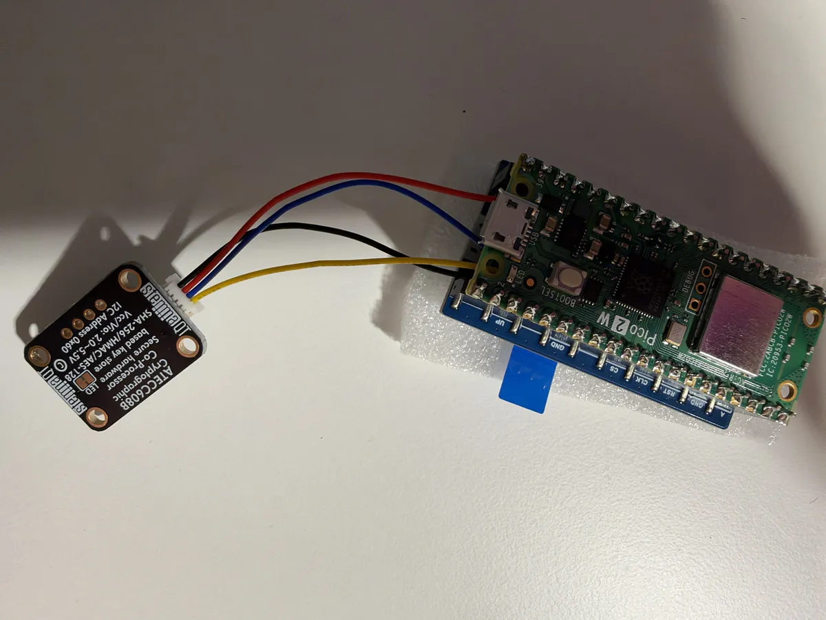 The chip board lying flat on the table, wired to the Pico, nothing else near it