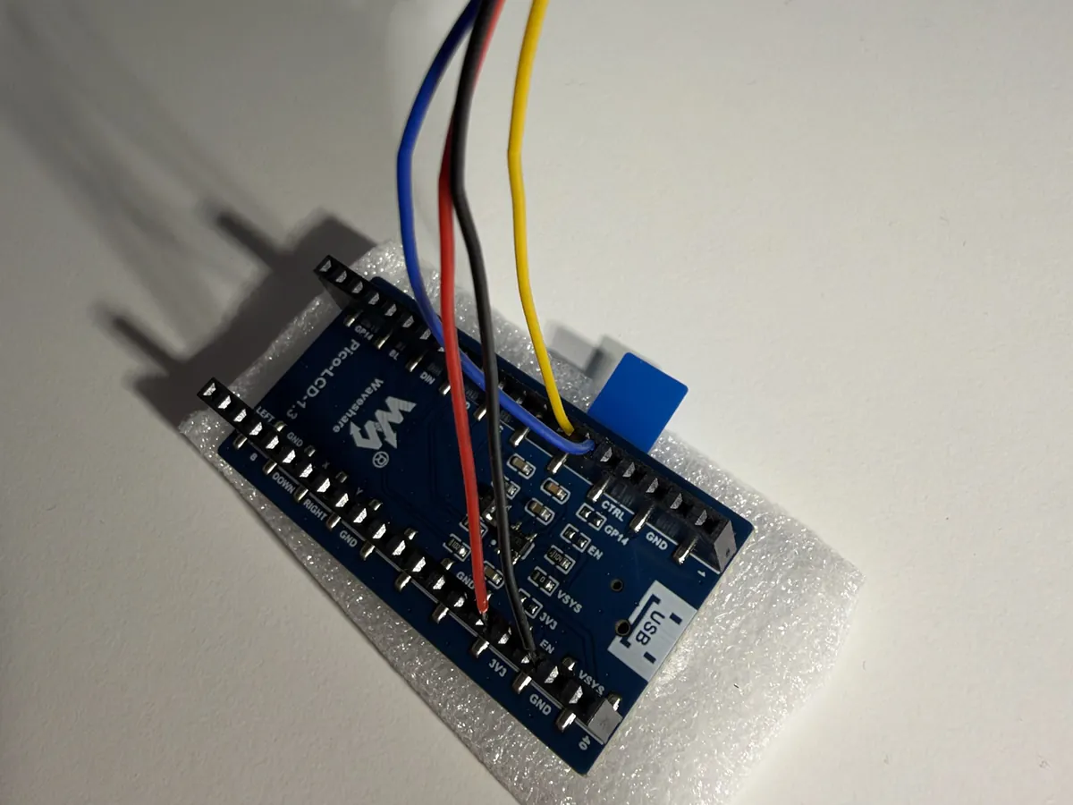 The back of the screen board with four wires pushed into its socket holes